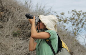 Tourist photographing wildlife in Galapagos