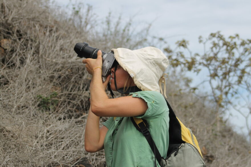 Tourist photographing wildlife in Galapagos